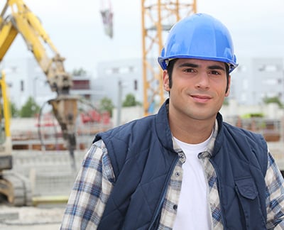 young self-employed worker with hard hat