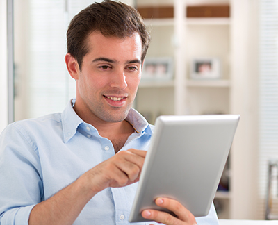 Man reading blog on tablet