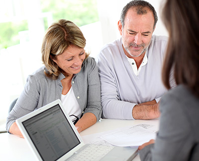 Couple looking at reverse mortgage details