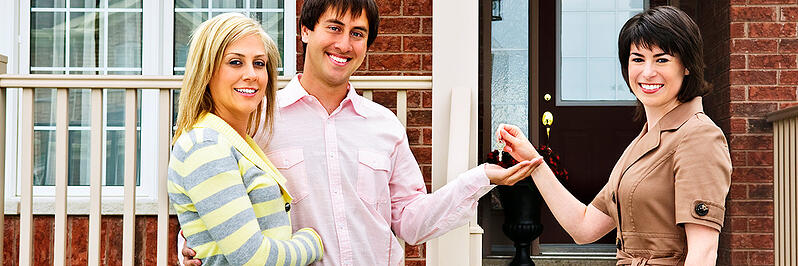 first-time-home-buyers get keys for new home in Edmonton