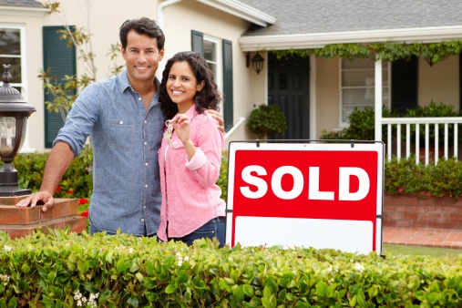 Couple with keys to new home